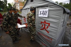 Chinese medic-camp in Dhulikel - but countless villages must pool their own resources.