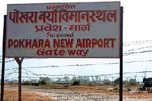 A worn billboard until now, long-projected Pokhara International Airport might soon be under construction