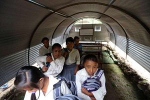 Post-quake, many students are left to study in tin shelters or under tarpaulins