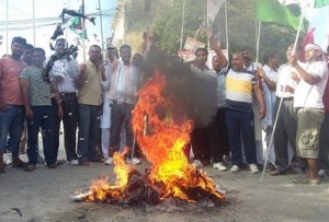 Protesters burning copies of the draft constitution while local economy is losing millions every day